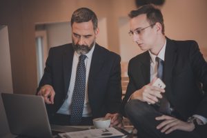 Consultant helping manager with EHS compliance